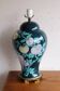 Vintage ceramic lamp with floral decoration.