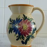 Old pitcher, pot to ance, faience, floral decoration.