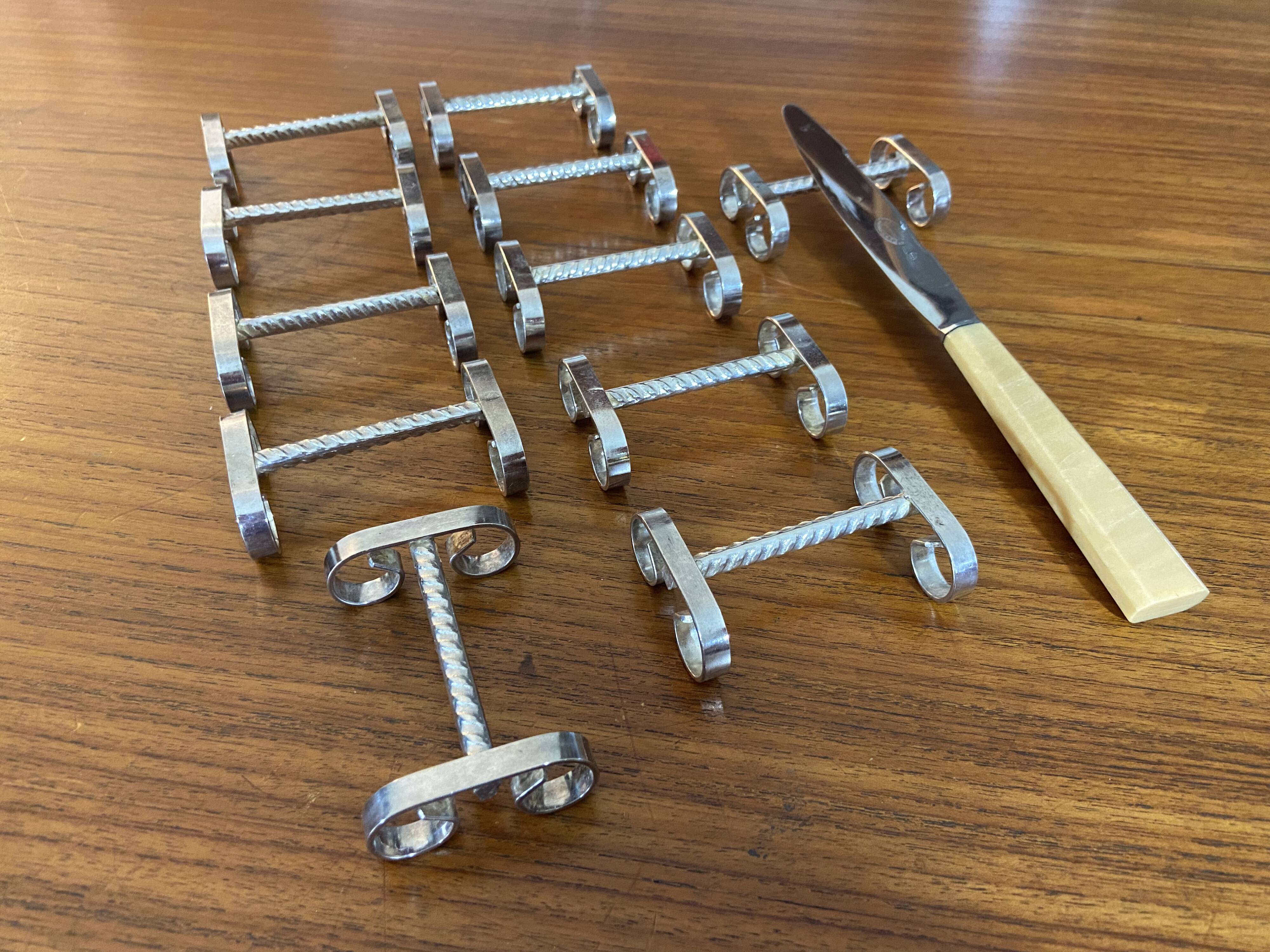 Set of 11 silver-plated metal knife holders, 1960