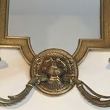 Pair of mirror and bronze wall lamps with lions' heads, french work. around 1940