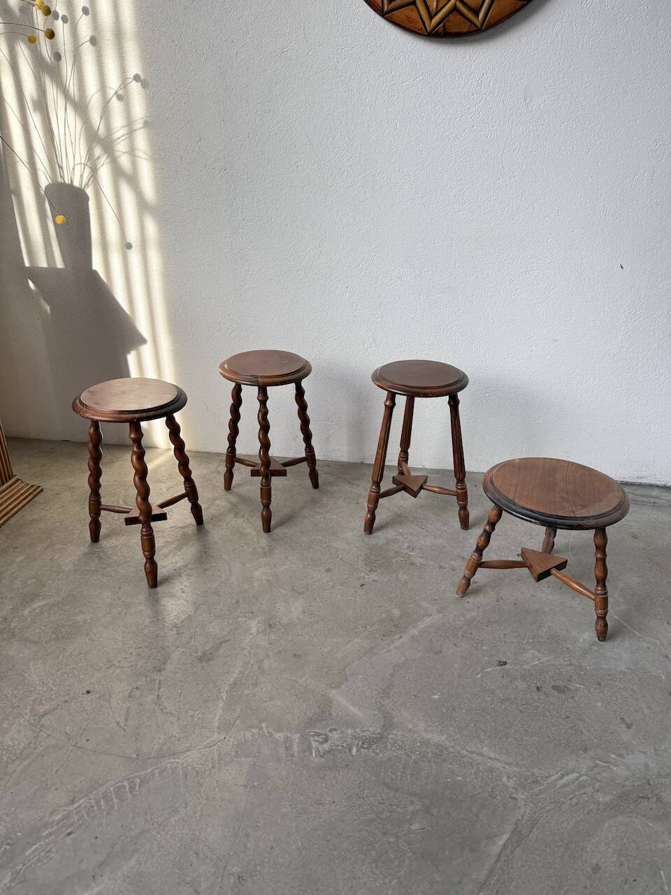 Set of 4 turned oak stools.