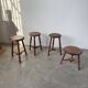 Set of 4 turned oak stools.