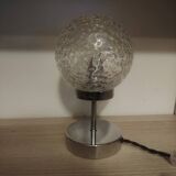 Duo of lamps in textured globe with a great play of light.
