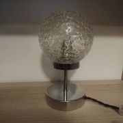 Duo of textured globe lamps with a large play of light.