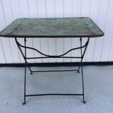 Folding riveted iron table