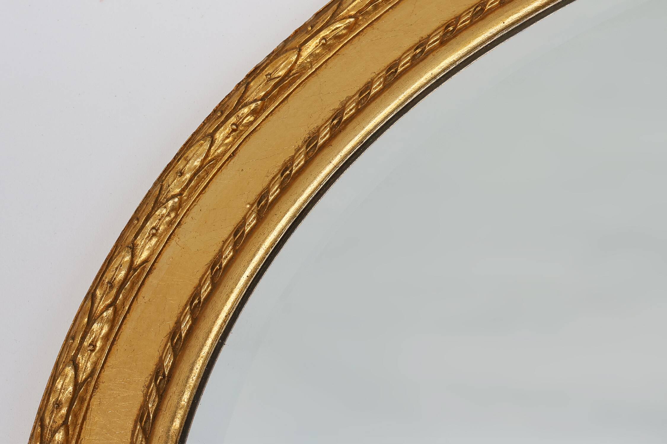 Oval shaped carved gilded Baroque mirror with beveled glass, Belgium