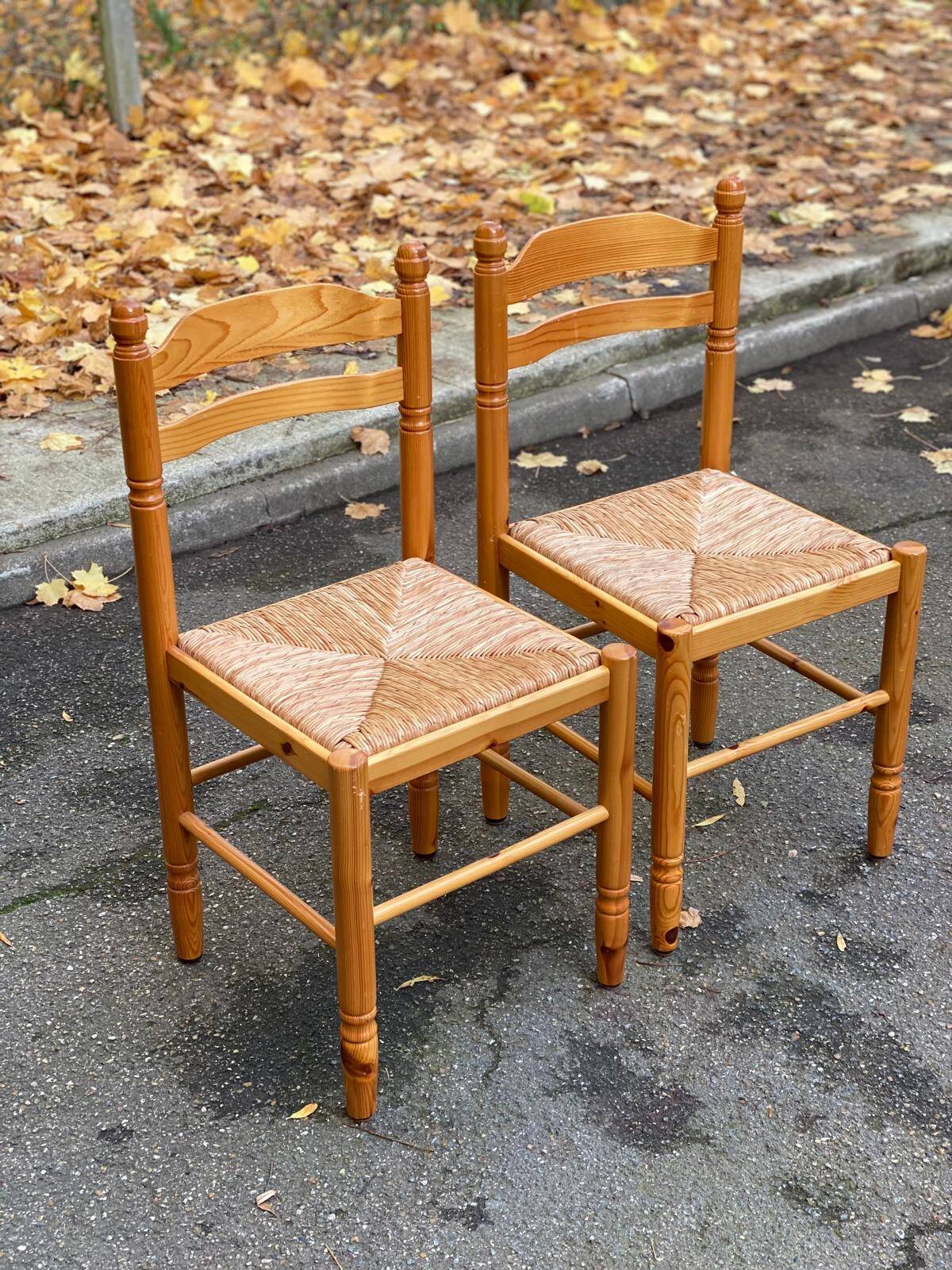 2 straw-seated chairs in light-colored solid wood