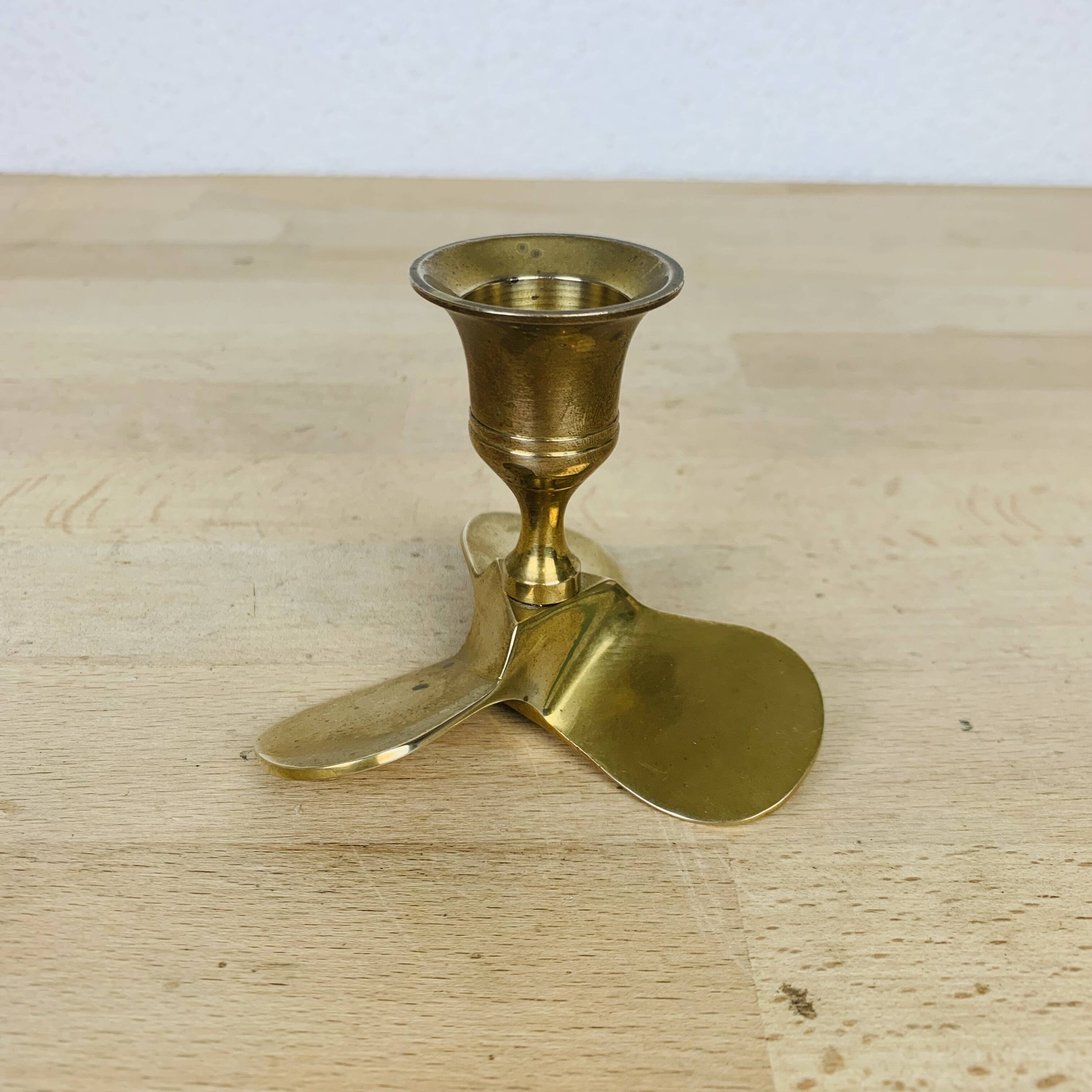 Golden brass propeller candle holder