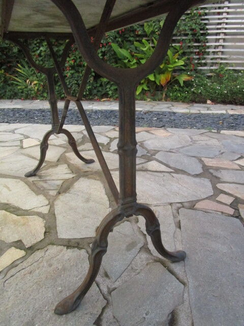 Antique marble bistro table and cast iron foot