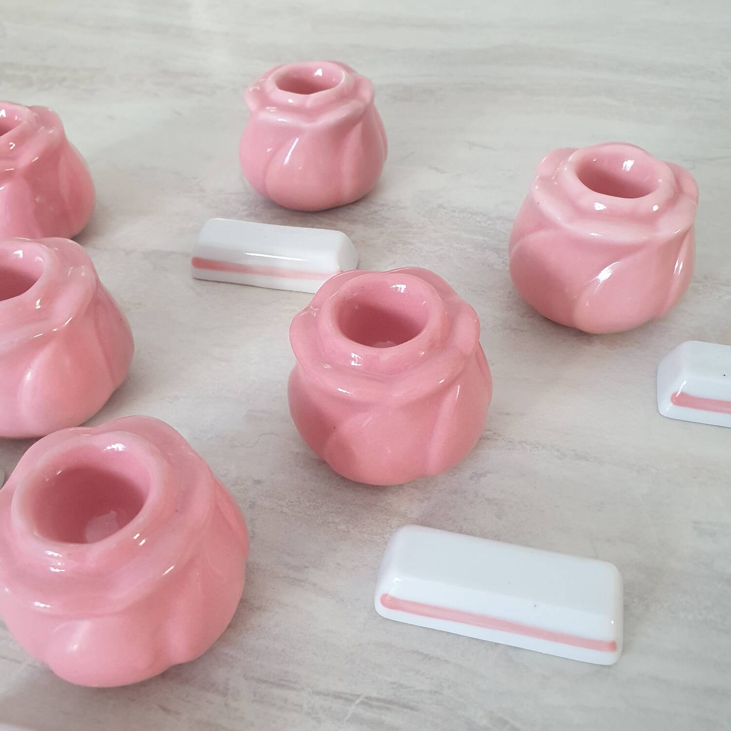 Pink candlesticks and porcelain knife holders