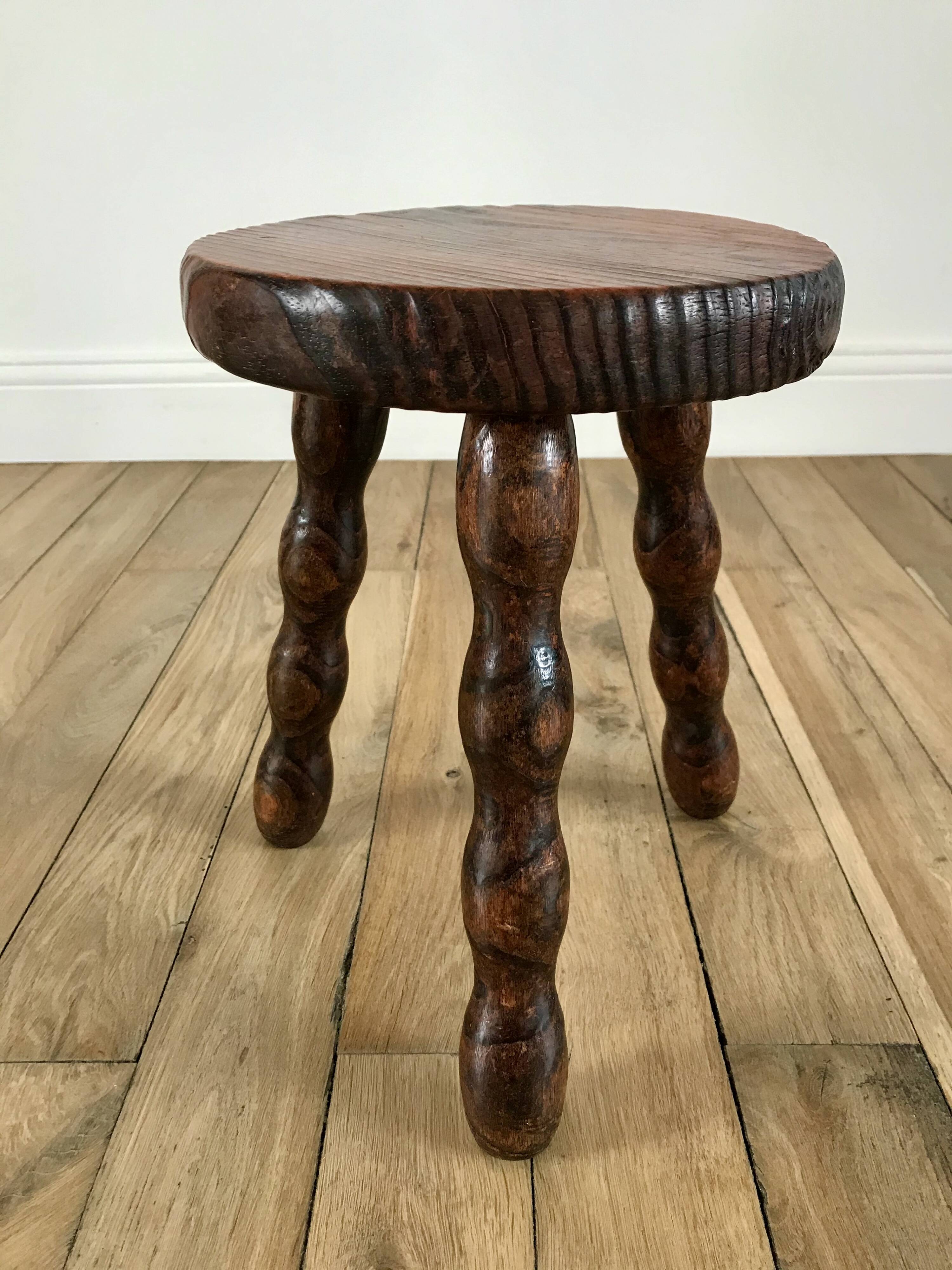 low stool in solid turned wood from the 70s