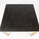 Coffee table with slate plate, frame of gilded metal and rosewood by Bendixen Design from the 1970s.