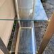 Vintage shelving unit in gold aluminum and glass