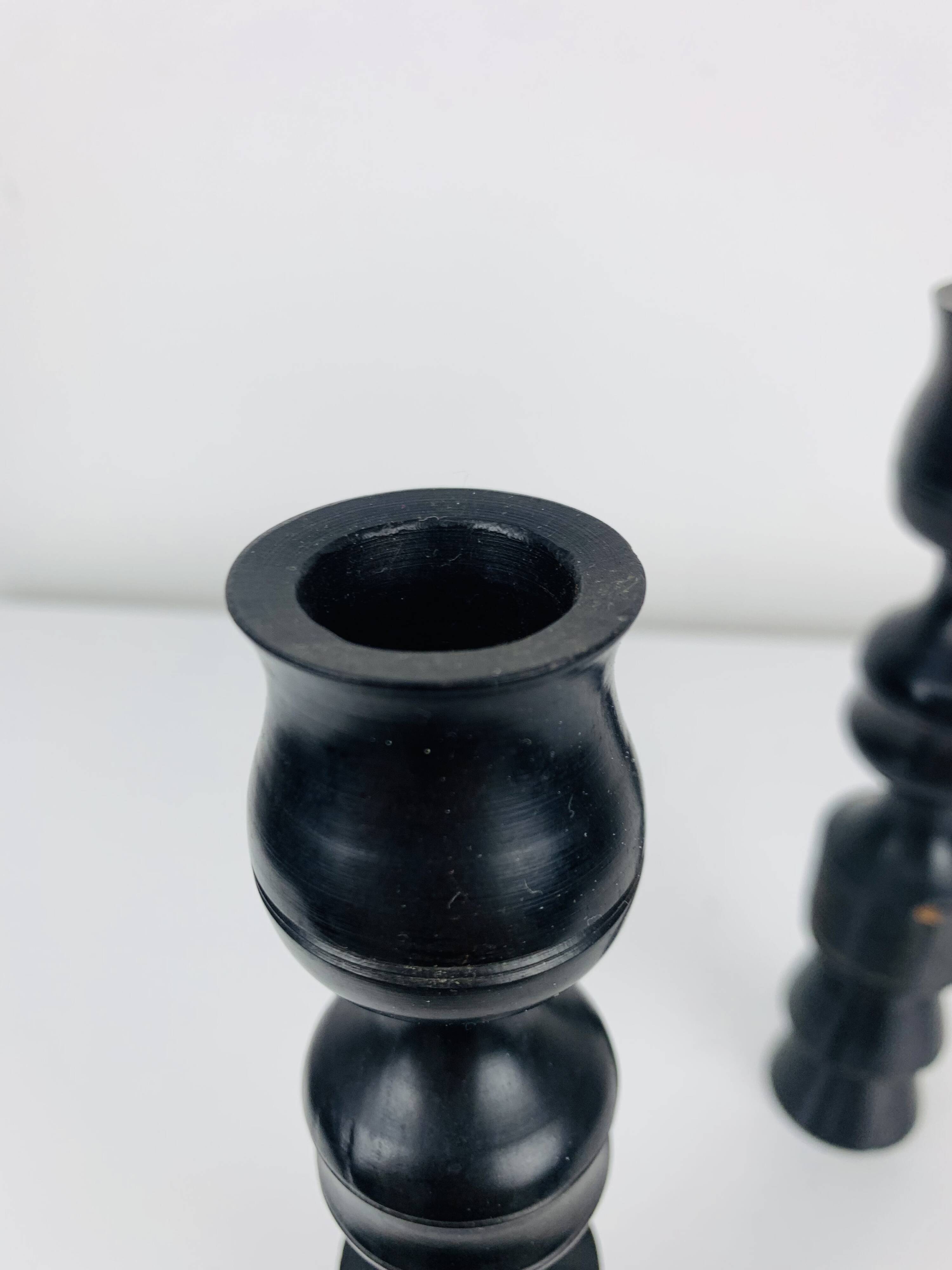 Pair of vintage ethnic blackened wood candlesticks