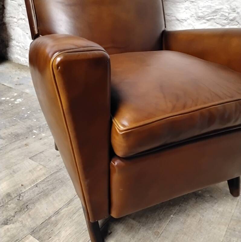 Antique club armchair from the 1950s with compass feet