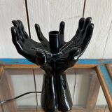 Lamp hands holding a globe