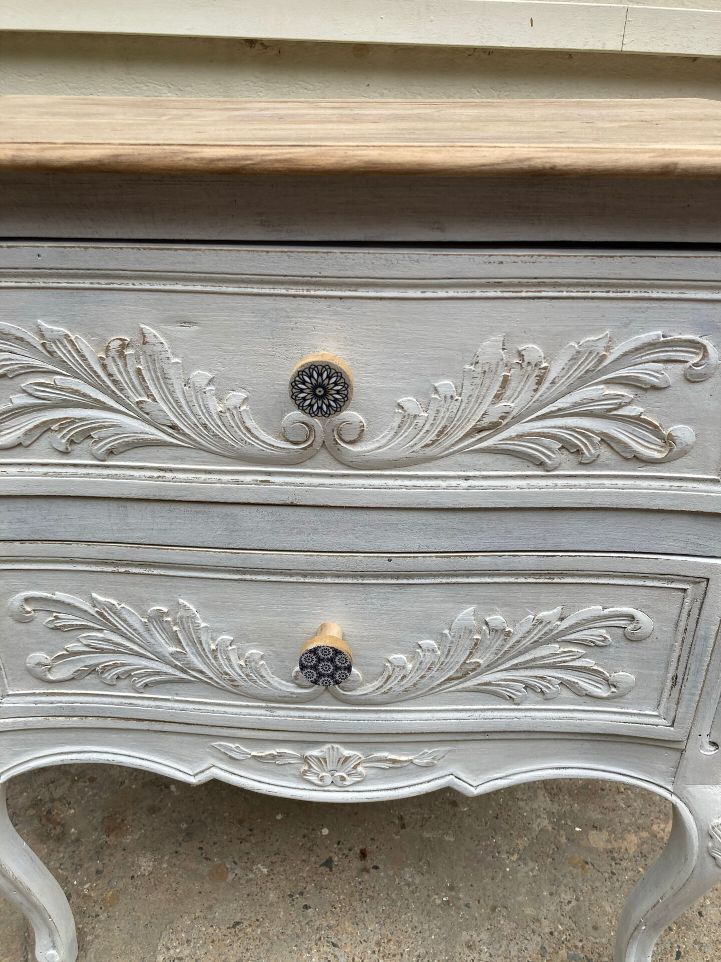 Adorable small chest of drawers or weathered white console.