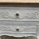 Adorable small chest of drawers or weathered white console.