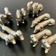 12 old dog-shaped Etains du Manoir knife holders