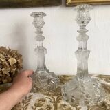 Pair of moulded glass candlesticks, ram heads and masks