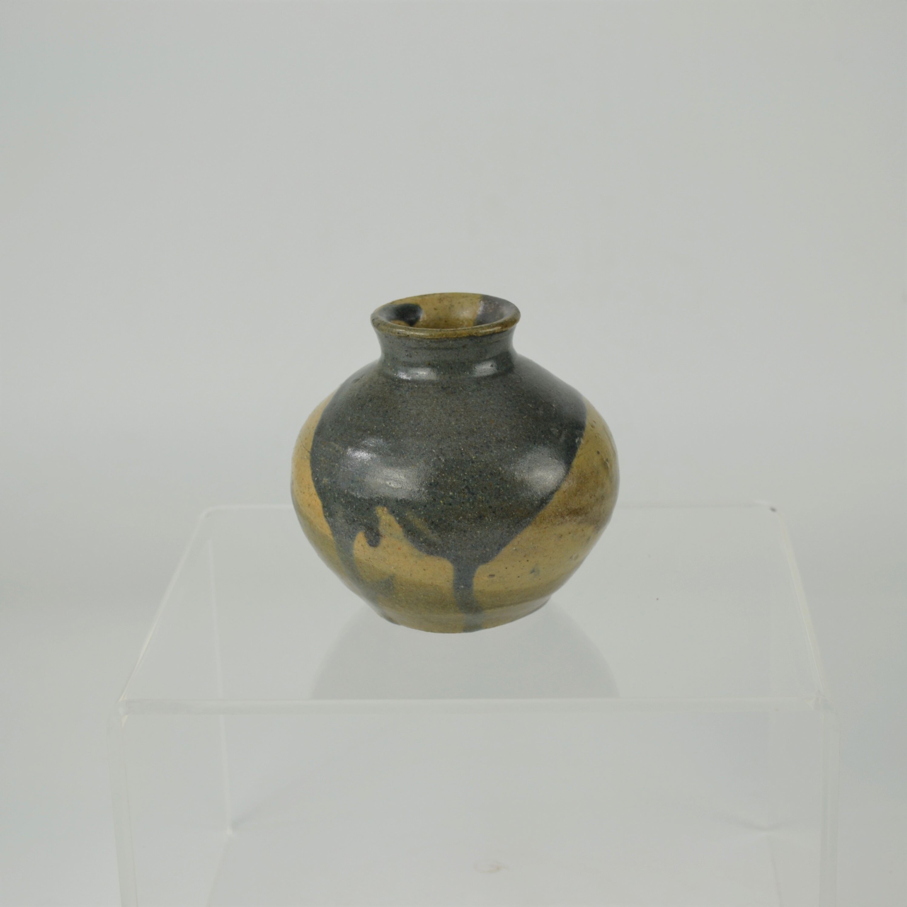 Sandstone ball vase by Eugène Lion