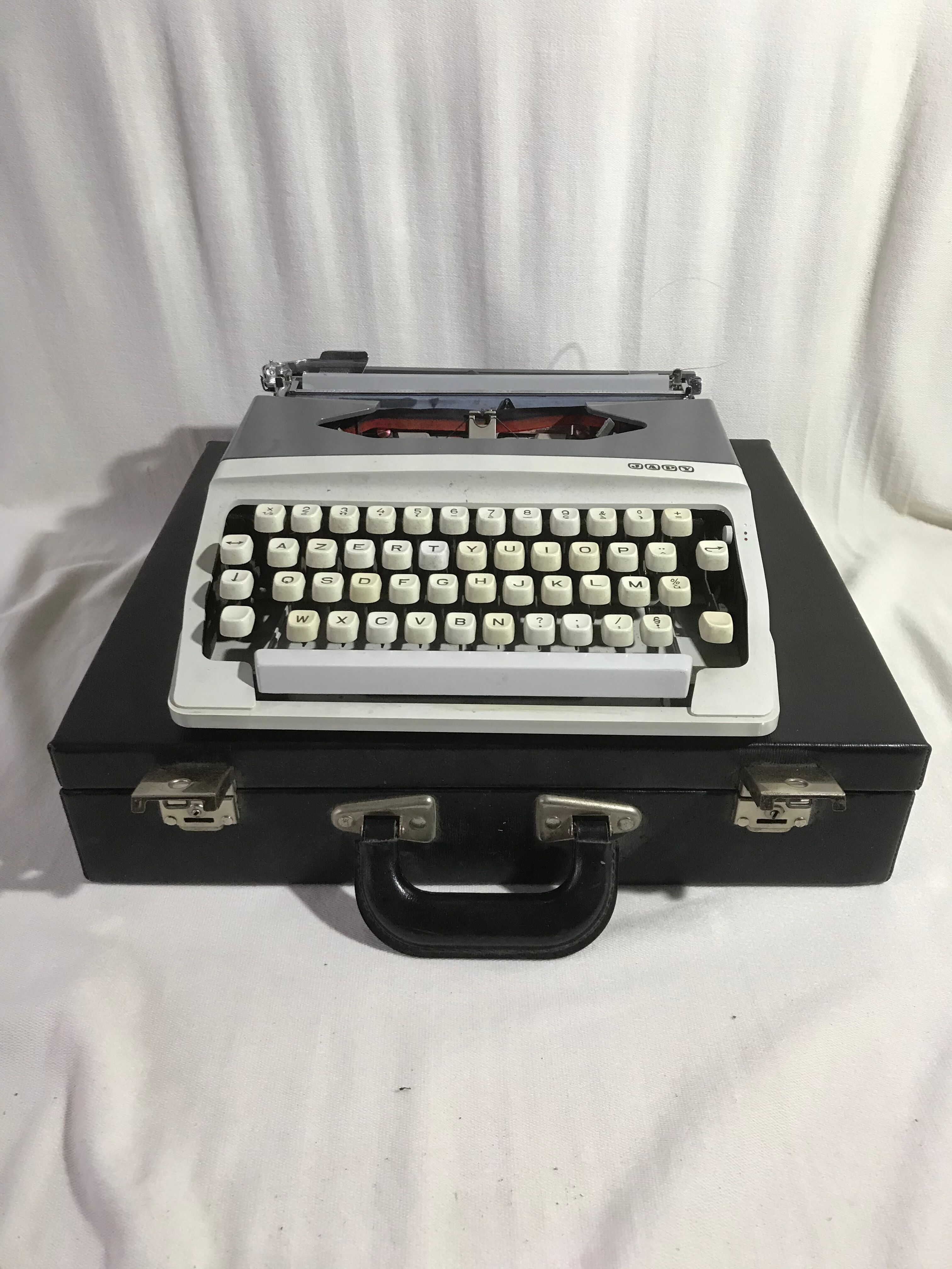 Former HJapy white metal writing machine - grey - vintage black malle