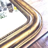 Old large Louis Phillipe mirror, gilded with gold leaf - Emilien"