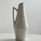 Ceramic pitcher with hand painted floral pattern