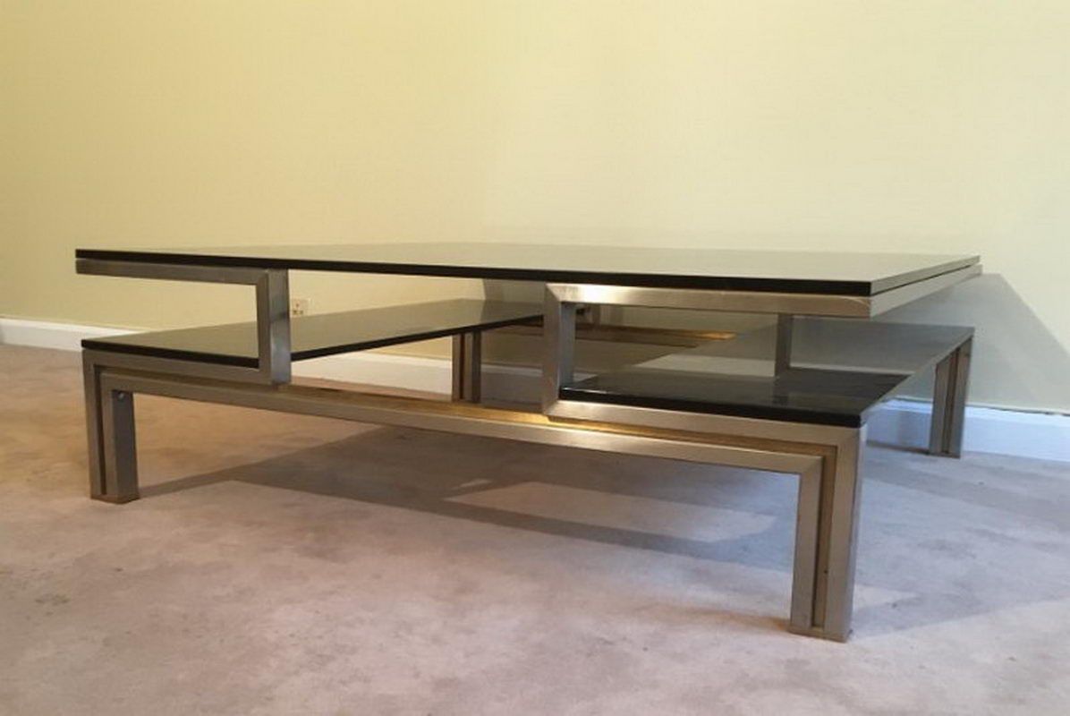 Very nice coffee table in brushed steel and brass