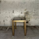 Trio of nesting tables, brass structures and smoked mirror tops