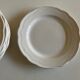 Set of 7 Mougins plates in white enamelled clay with gadroons