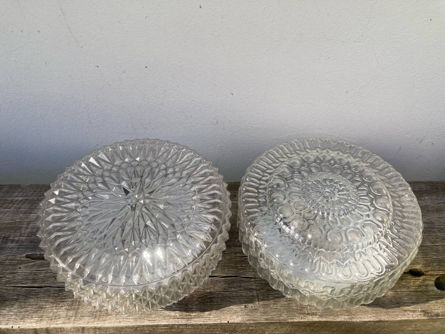 Pair of transparent round glass wall lights