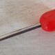Glass ice bucket, metal spoon and vintage bakelite