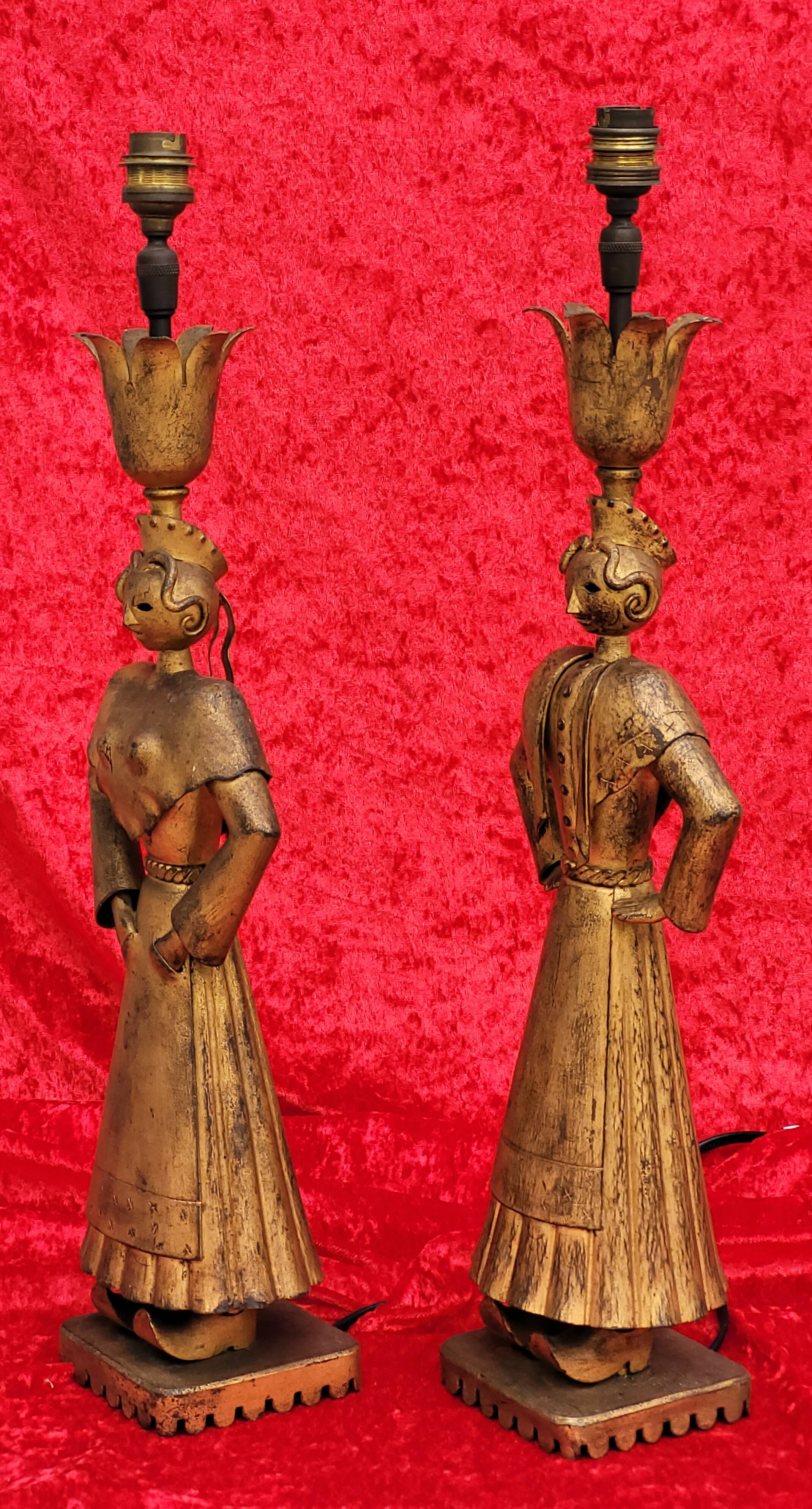Pair of gilded beaten iron sculpture lamps attributed to Gilbert Poillerat