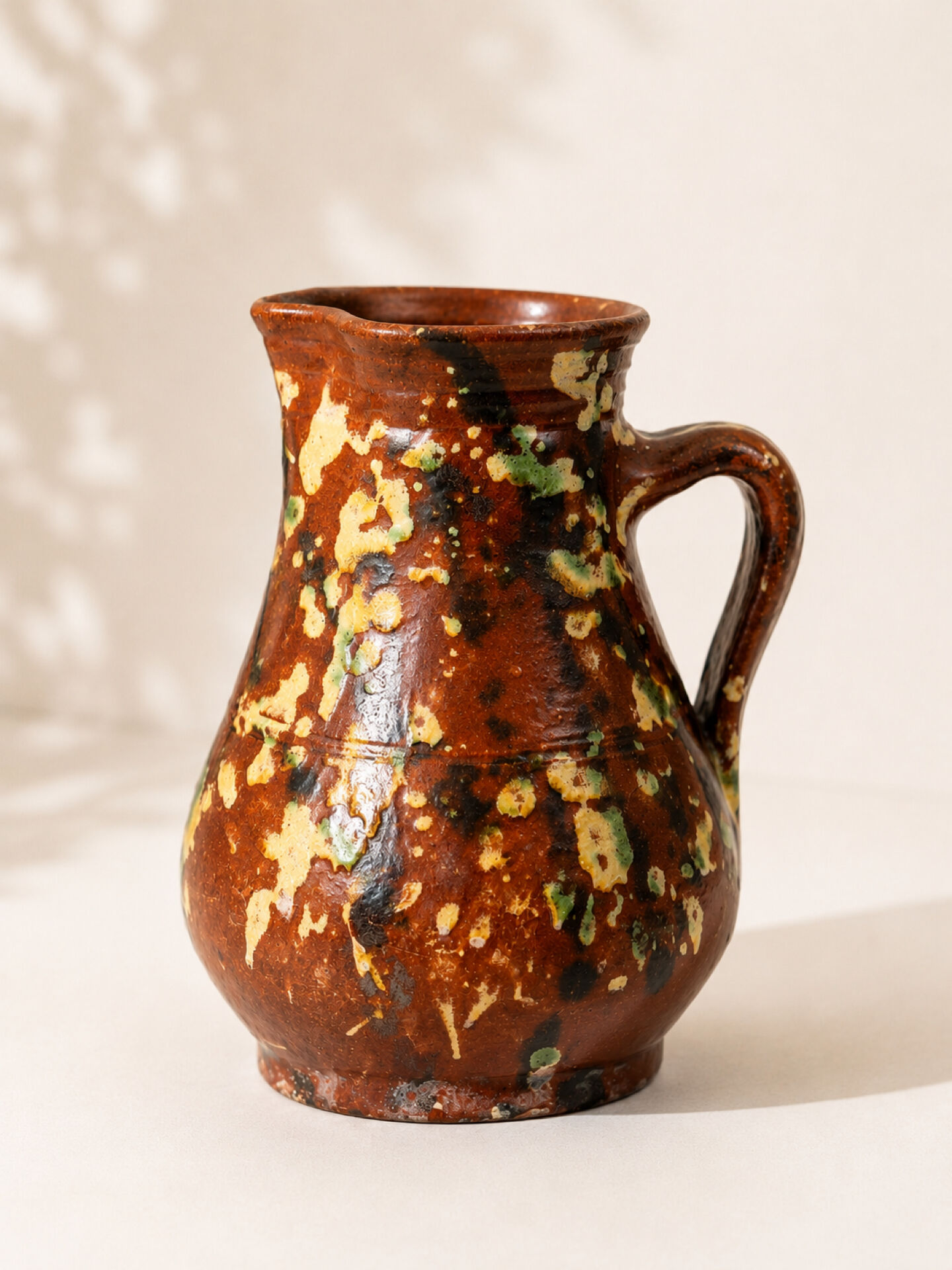 Studio ceramic pitcher with sprayed glazes – circa 1960-70