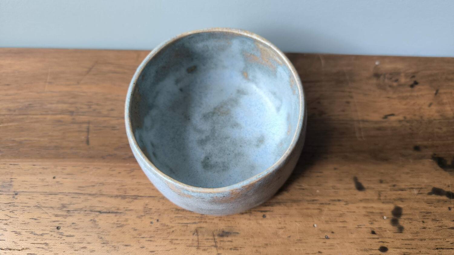 Handmade ceramic stoneware mug with blue enamel