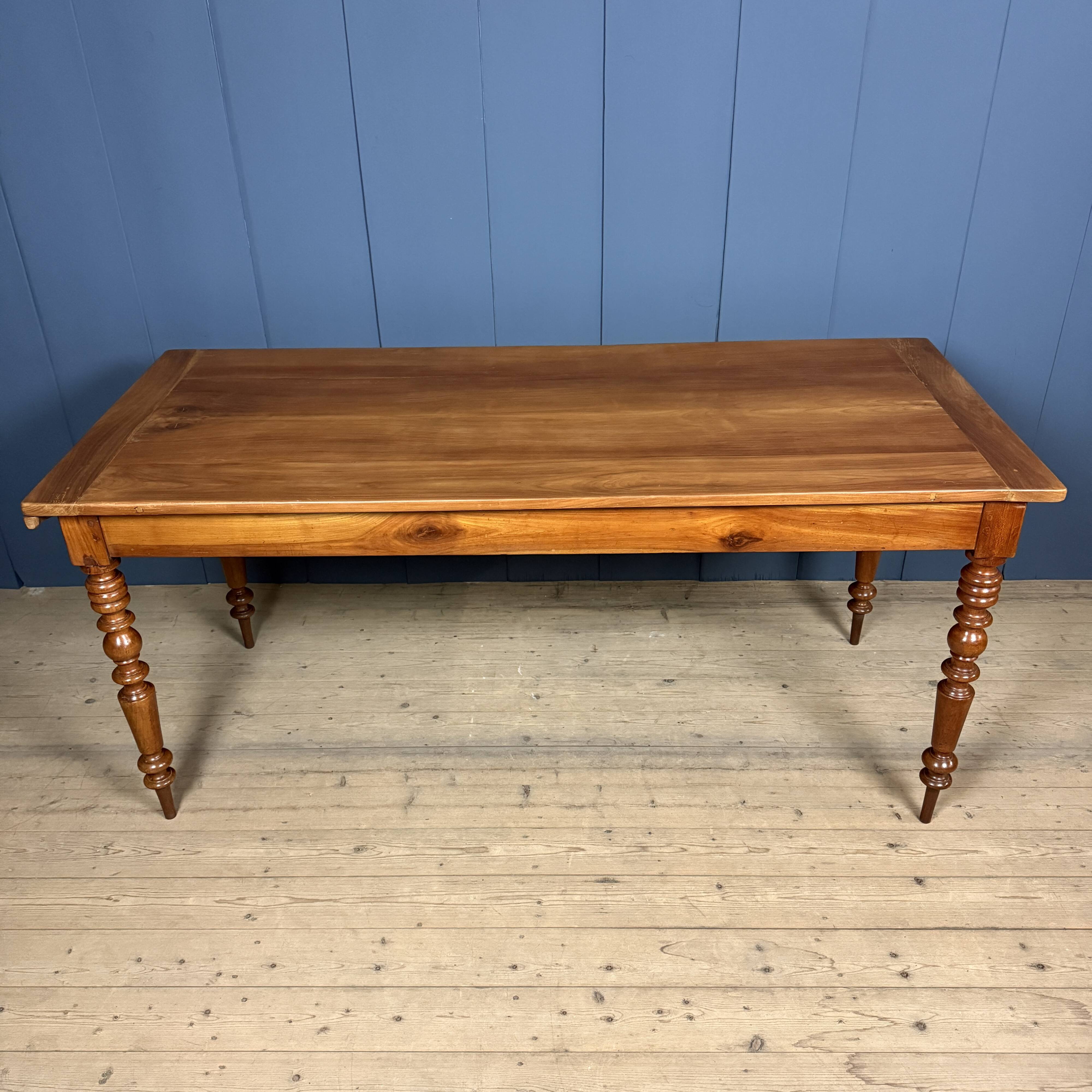 Antique cherry wood dining table from France.