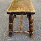 Small vintage low stool made of turned solid wood footrest 1960