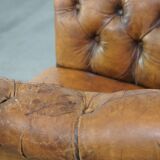 Fauteuil chesterfield sur roulettes en cuir de mouton