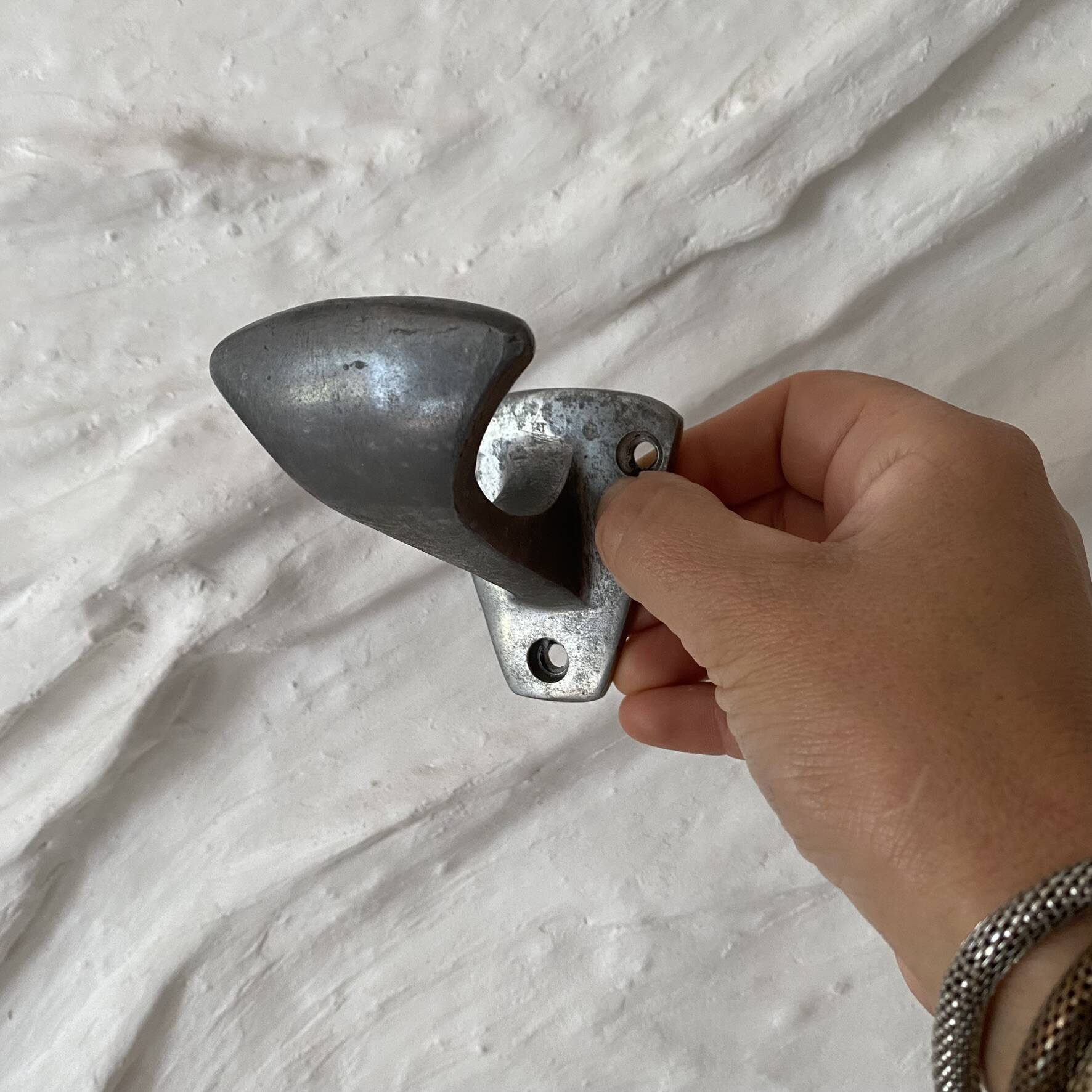 Set of 3 vintage steel hooks from a school.