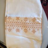 Damask tablecloth with golden patterns