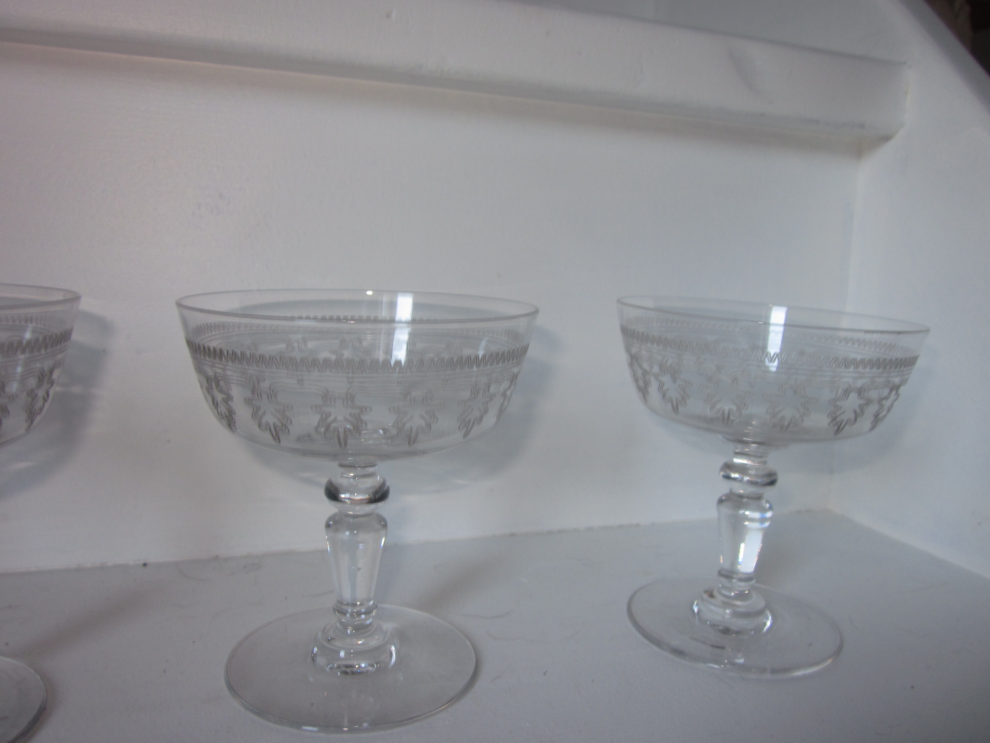 4 old champagne glasses