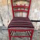 Red carved wood bedroom chair & vintage striped fabric seat