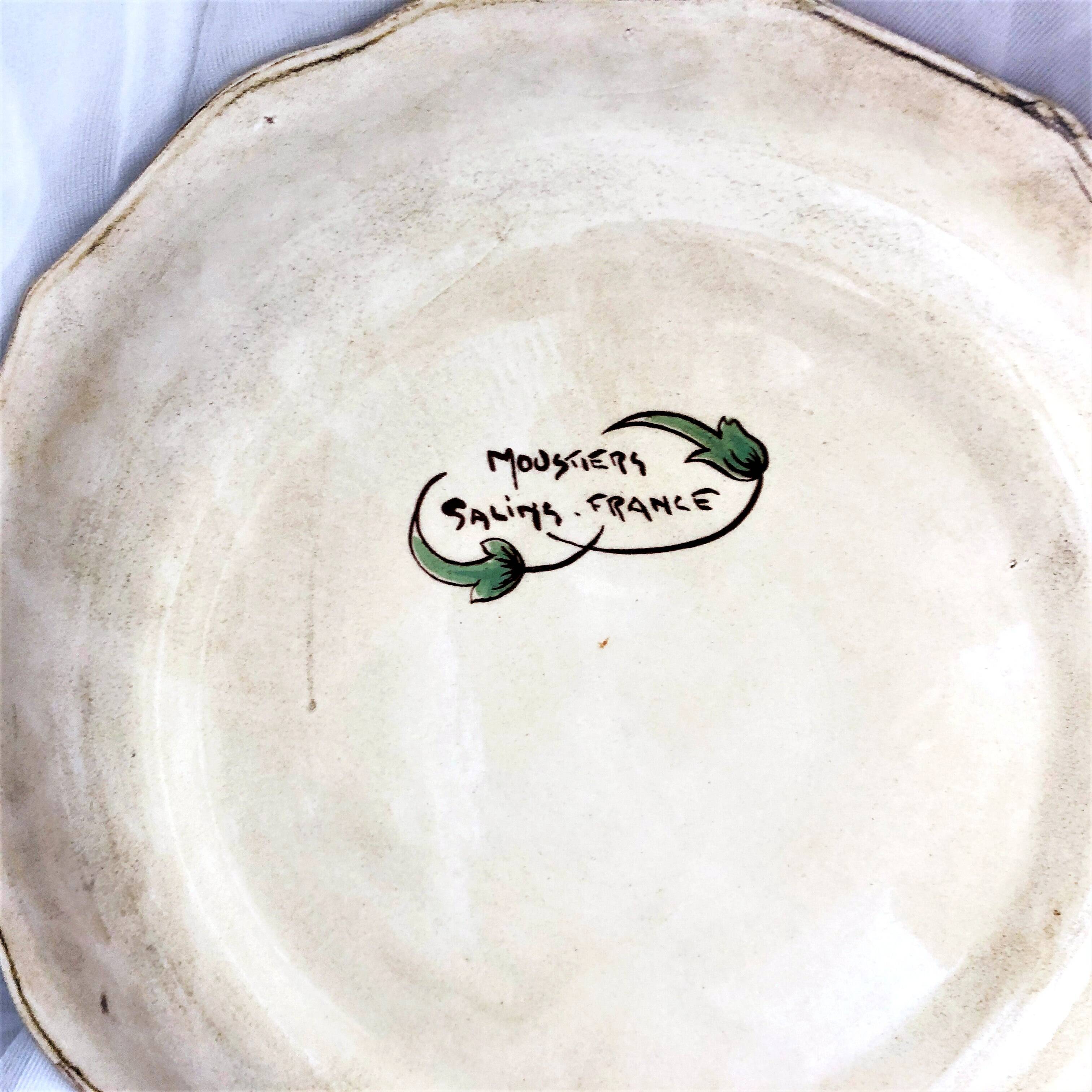 Decorative earthenware plate from Salins France, Moustiers decor, 25.5 cm