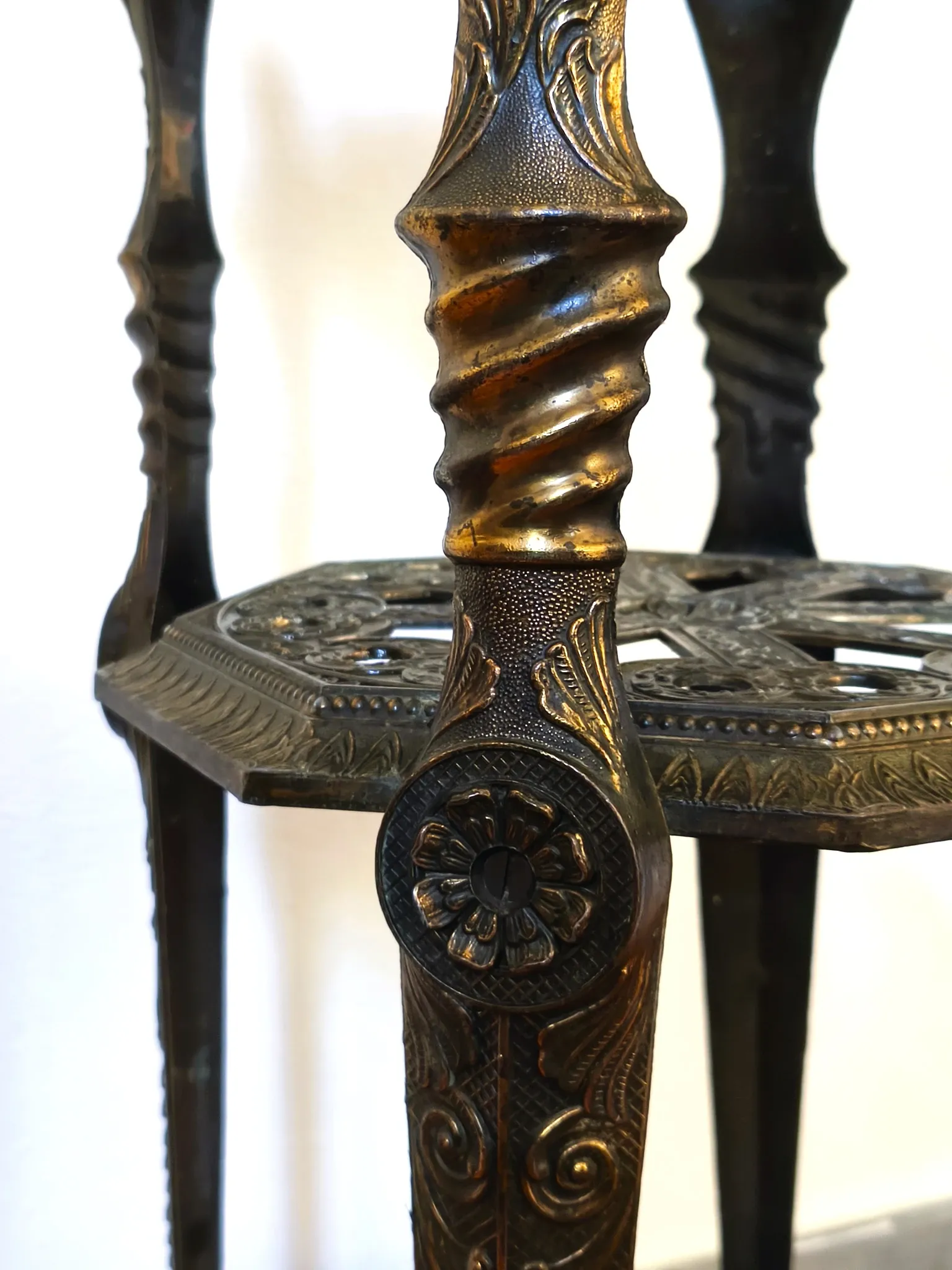 Italian side table with three openwork shelves in patinated metal.