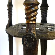 Italian side table with three openwork shelves in patinated metal.