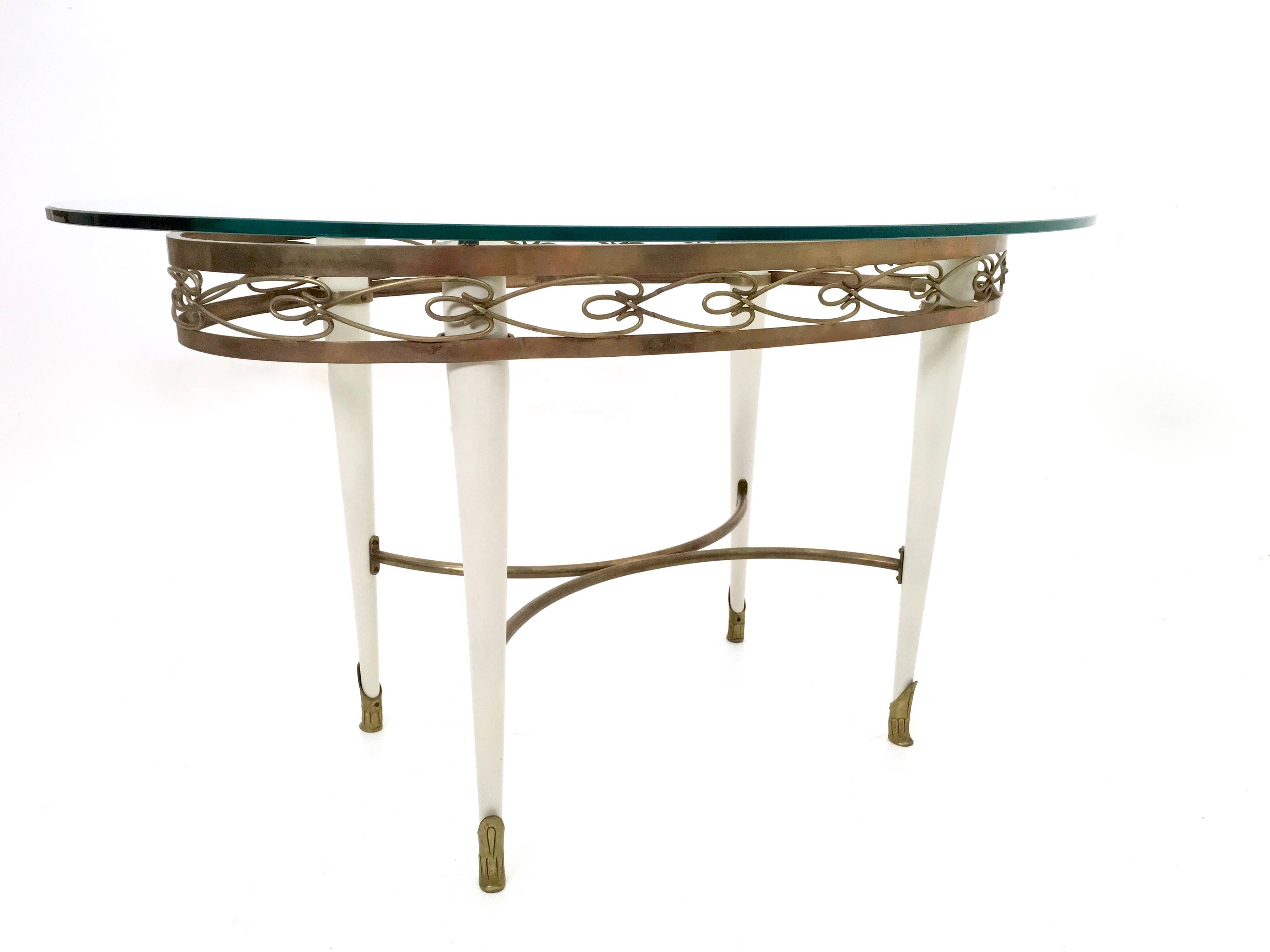 Brass Coffee Table with an Oval Glass Top in the Style of Pierluigi Colli