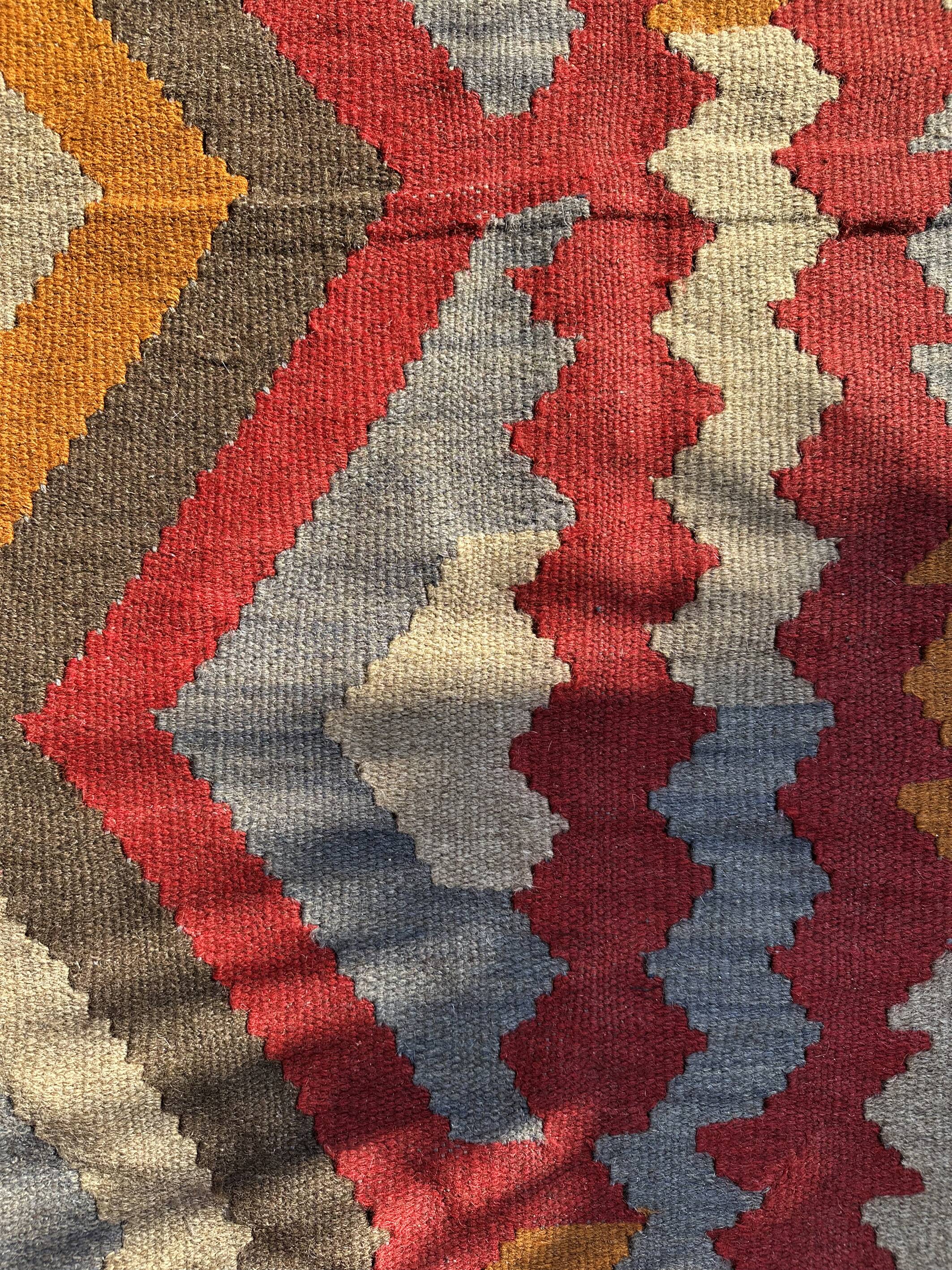 Multicoloured handmade wool kilim rug. Turkey, 1970s.