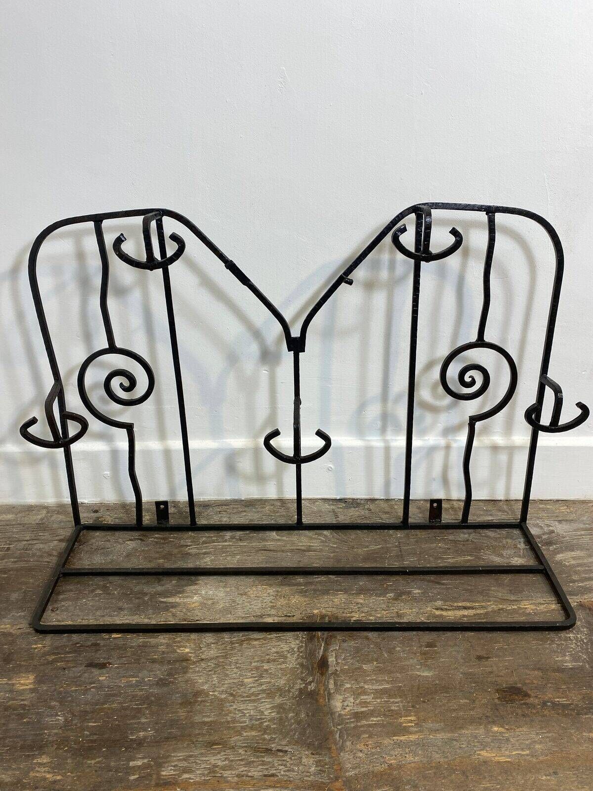 Wall-mounted coat rack in wrought iron, early 20th century