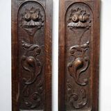 Pair of decorative wall panels in carved wood from the 19th century.